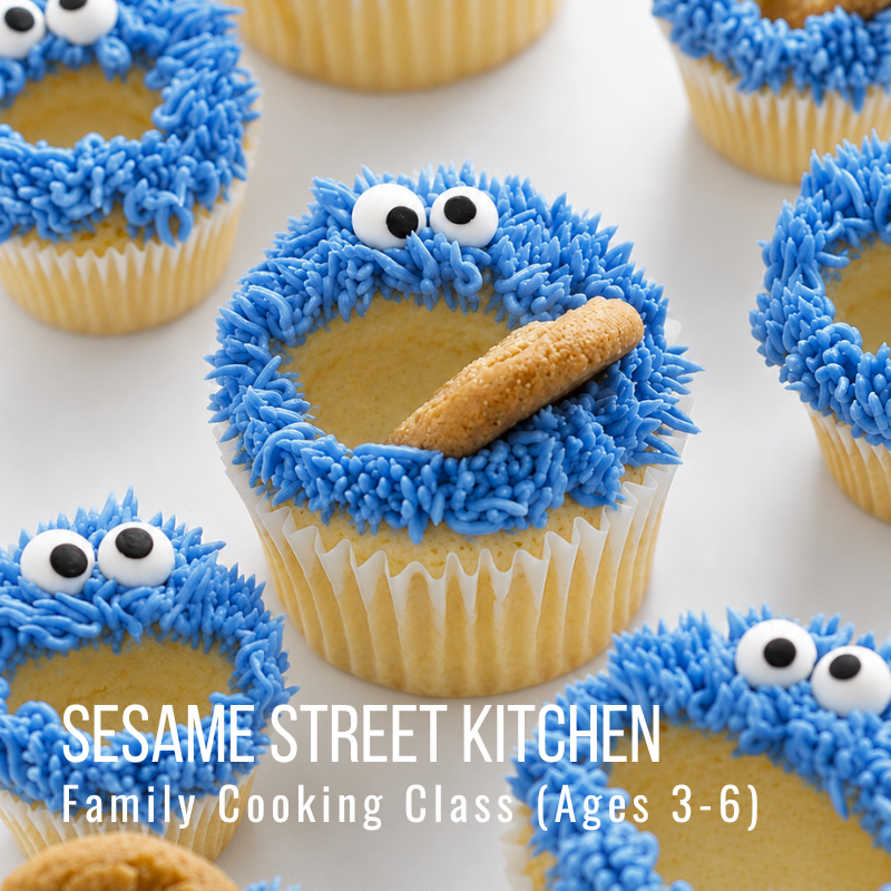 Cupcakes decorated with blue frosting and googly eyes resembling Cookie Monster.