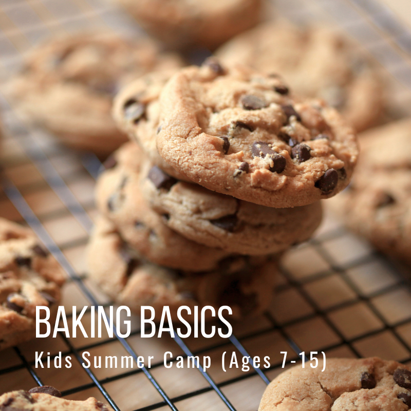 Stack of chocolate chip cookies on cooling rack.