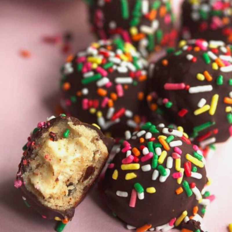 a close up of a piece of cake covered in chocolate