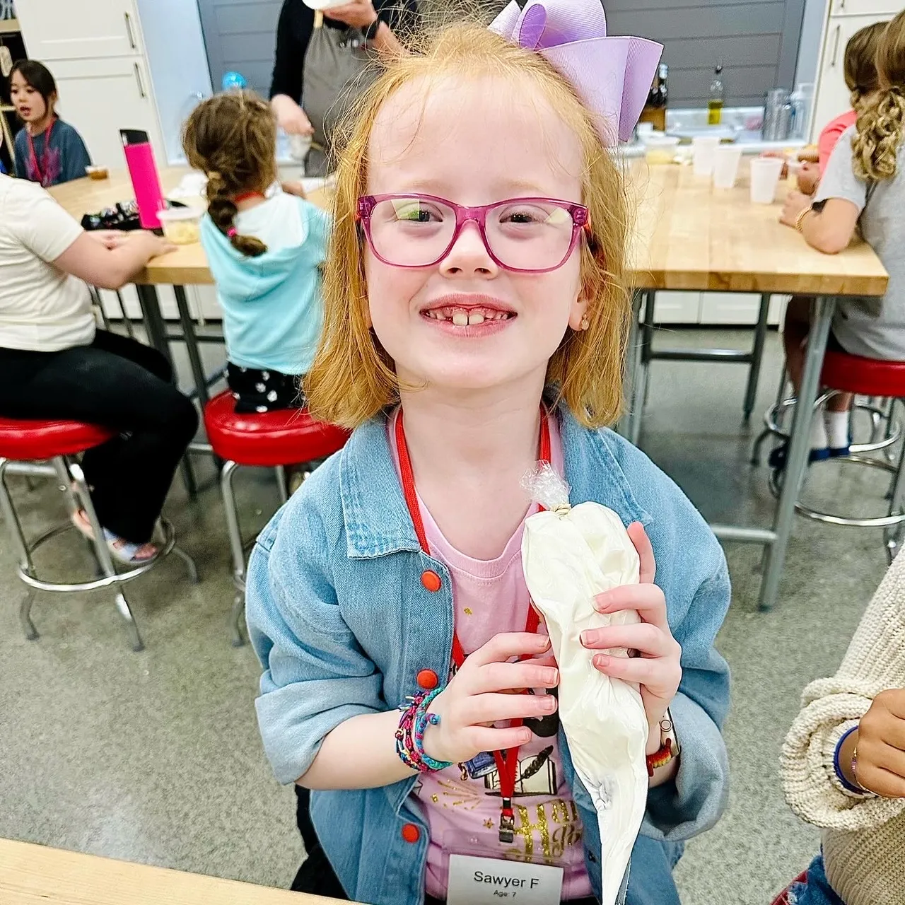 a group of people sitting at a table eating food