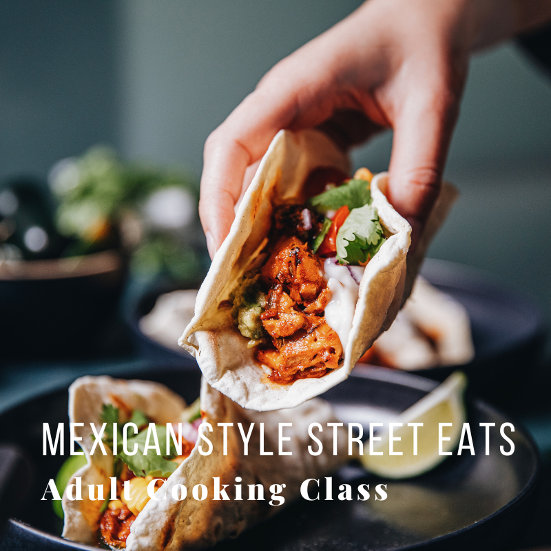 Hand holding a taco with text: Mexican Style Street Eats, Adult Cooking Class.