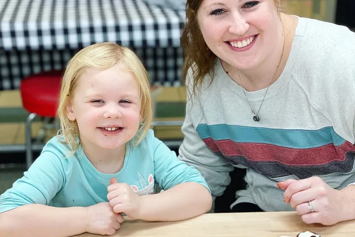 a couple of people that are sitting on a table