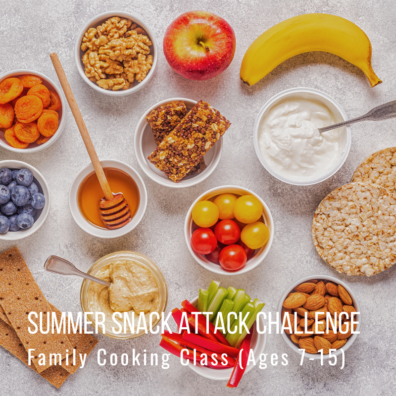 Various healthy snacks including fruit, nuts, and hummus for a family cooking class.