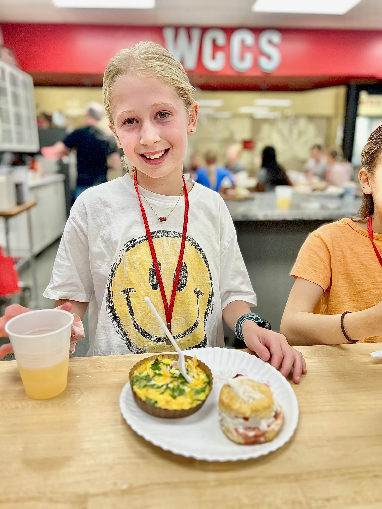a person sitting at a table with a plate of food