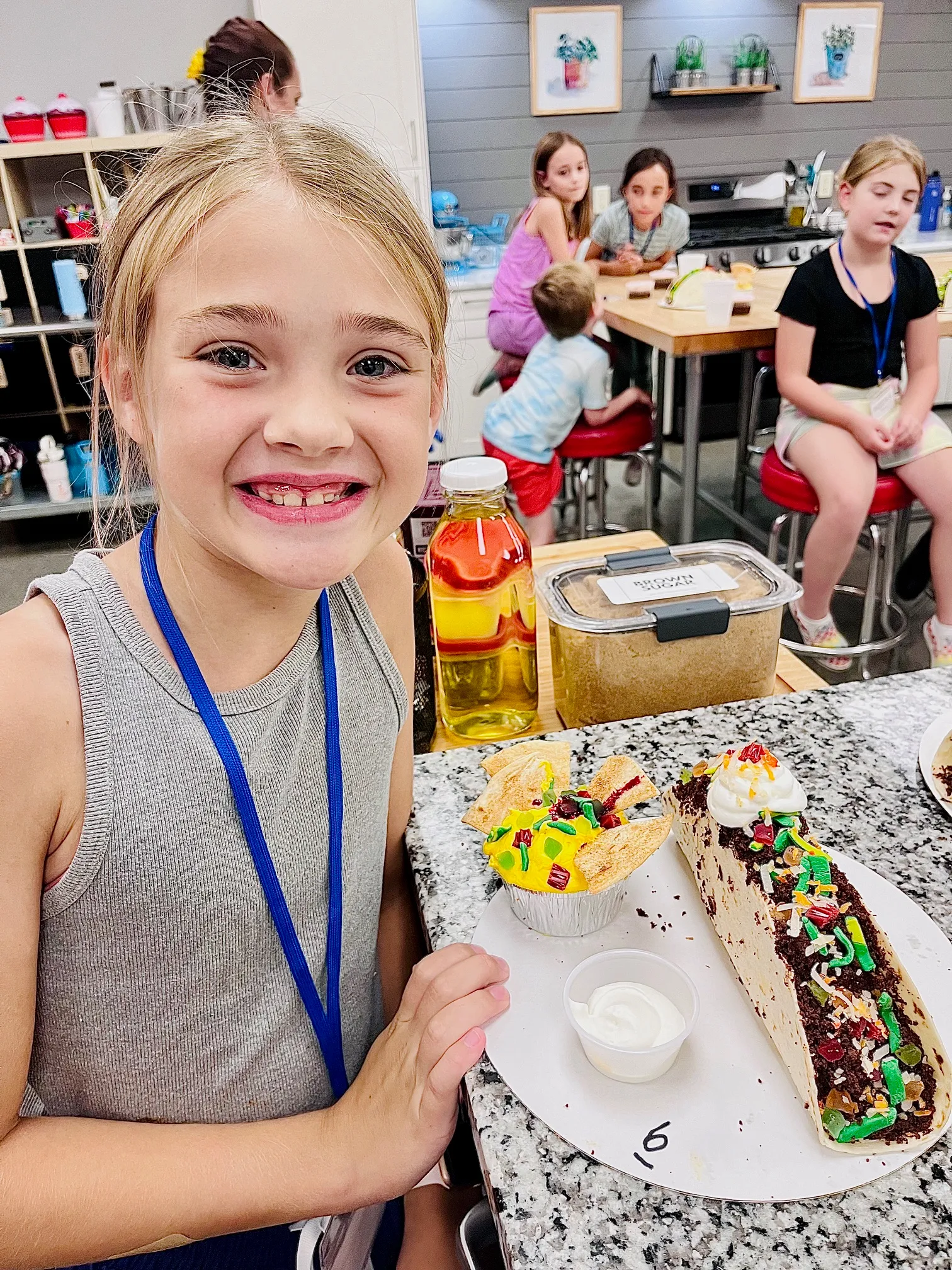 a woman holding a birthday cake