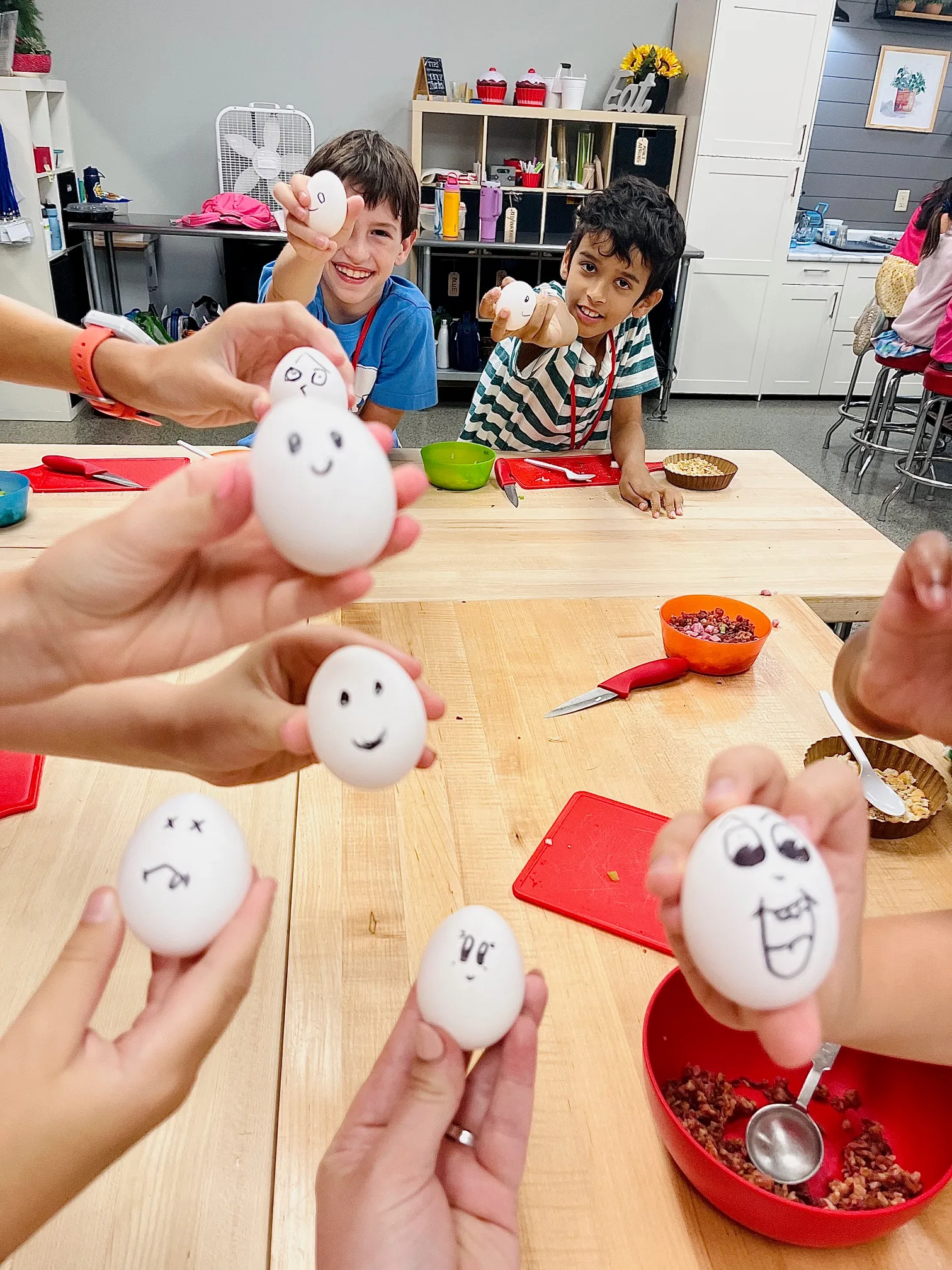 a person holding a bunch of stuffed animals
