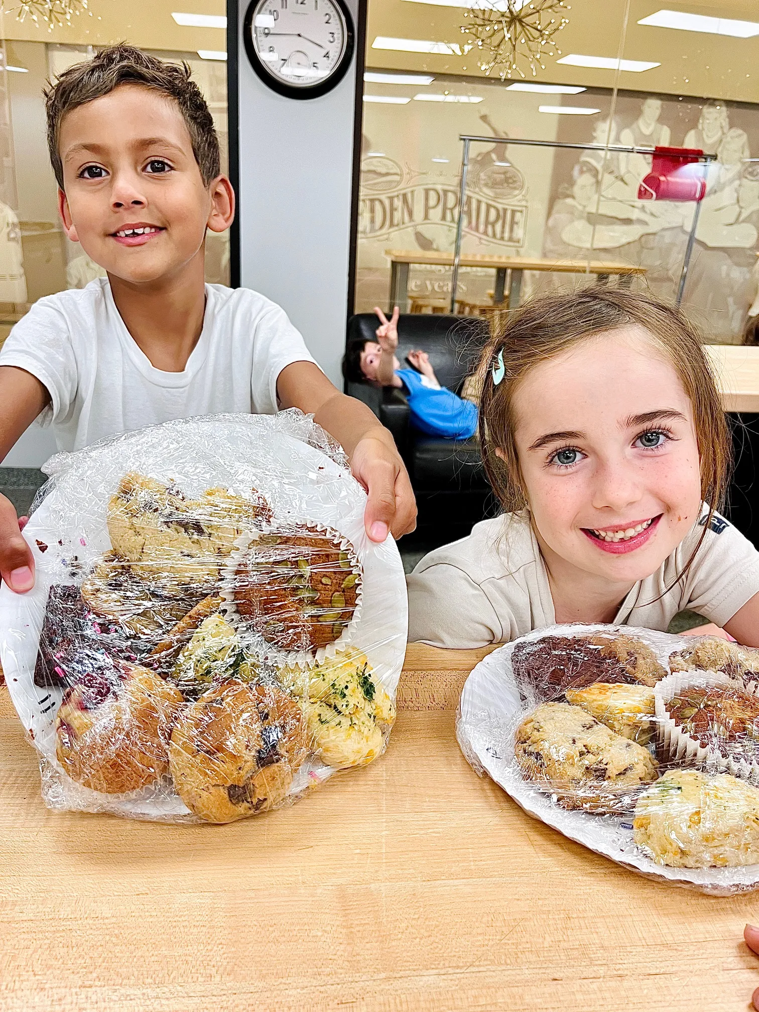 a person sitting at a table with a plate of food