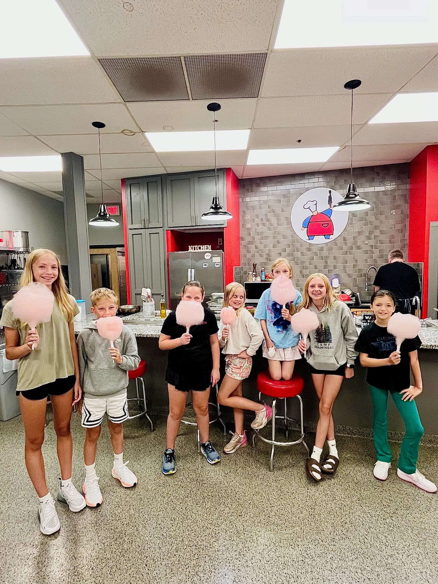 a group of people standing in front of a crowd posing for the camera