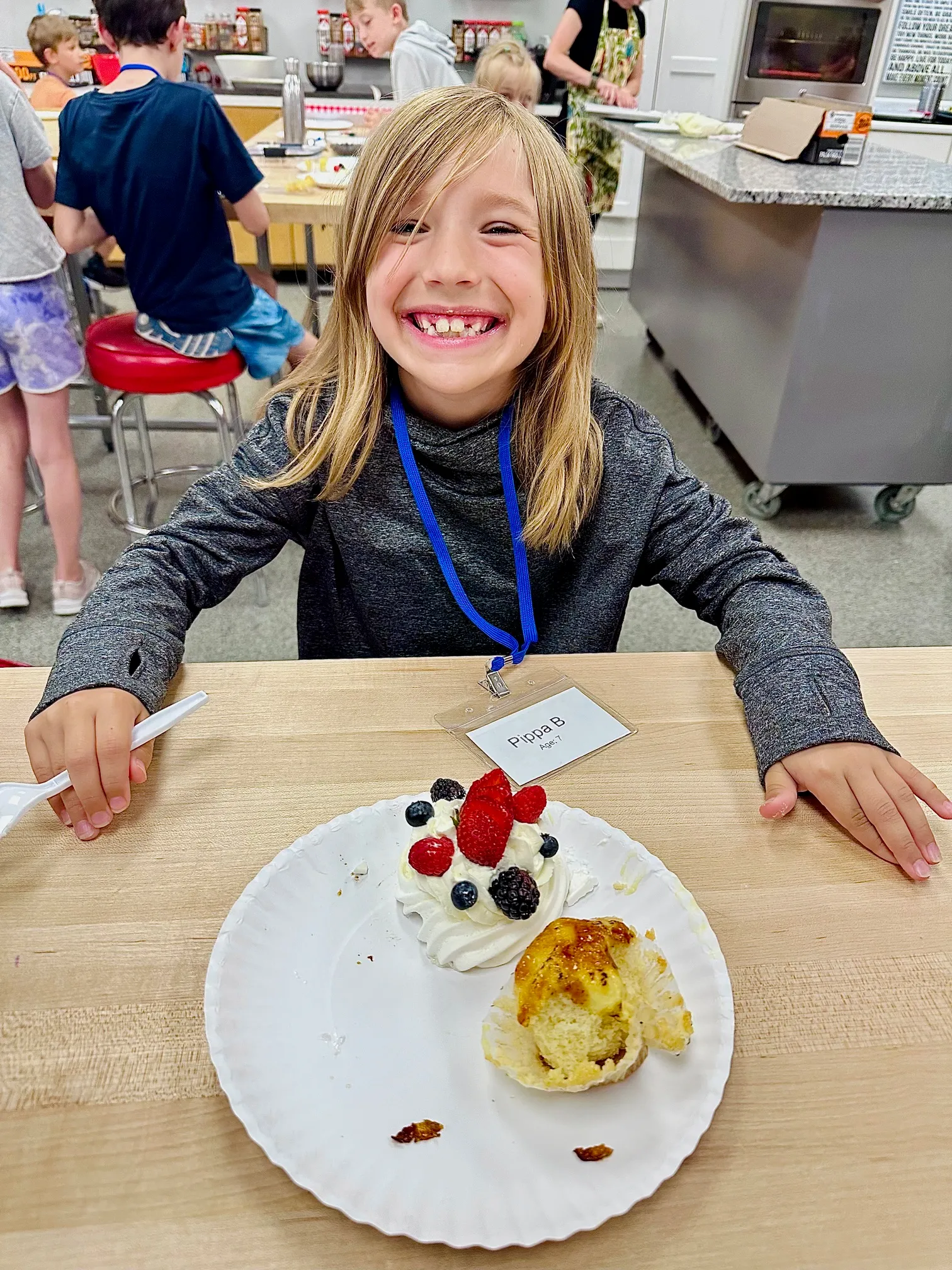 a person sitting at a table with a plate of food