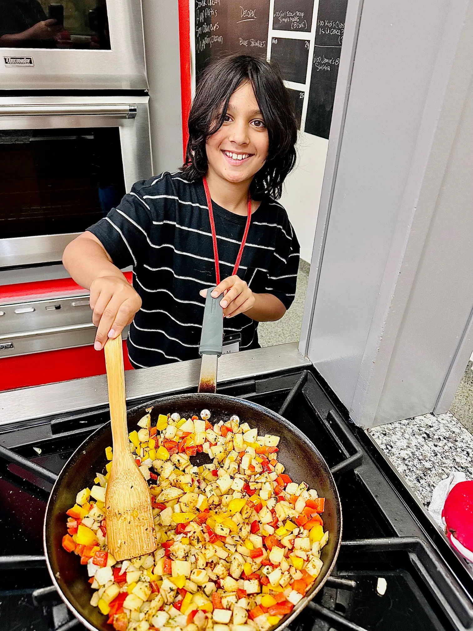 a woman holding a pan of food