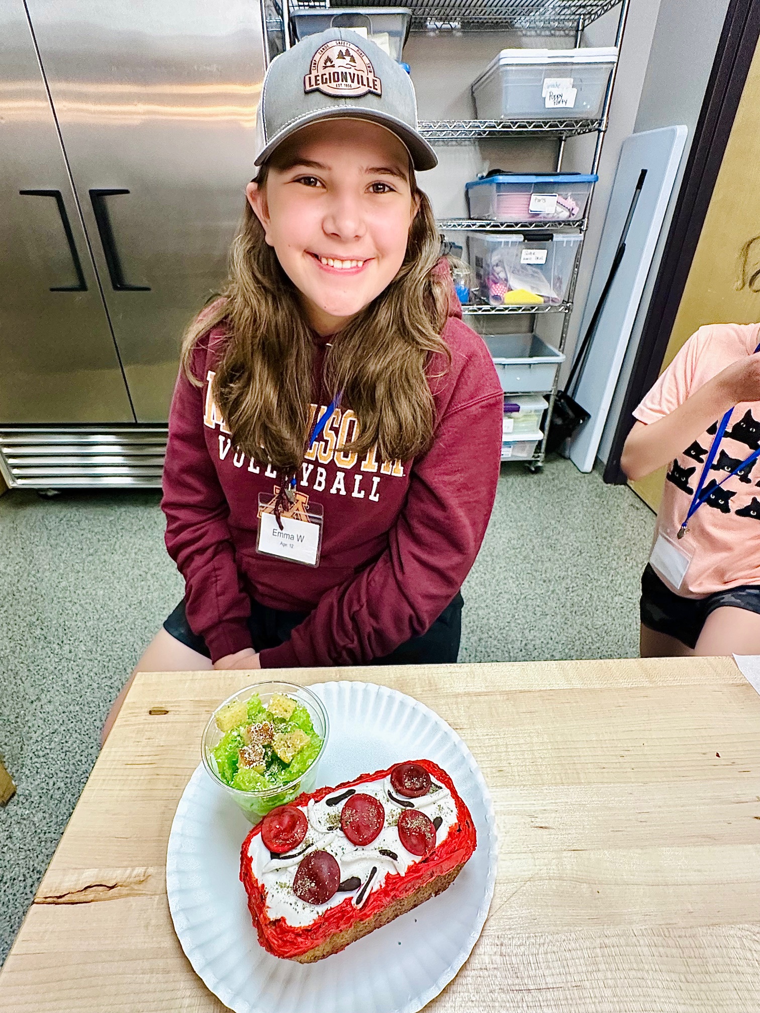 a little girl sitting on a table