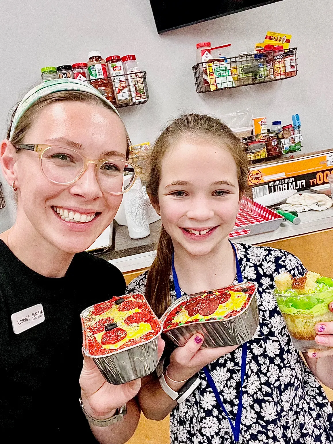 a close up of a man and a woman eating a donut