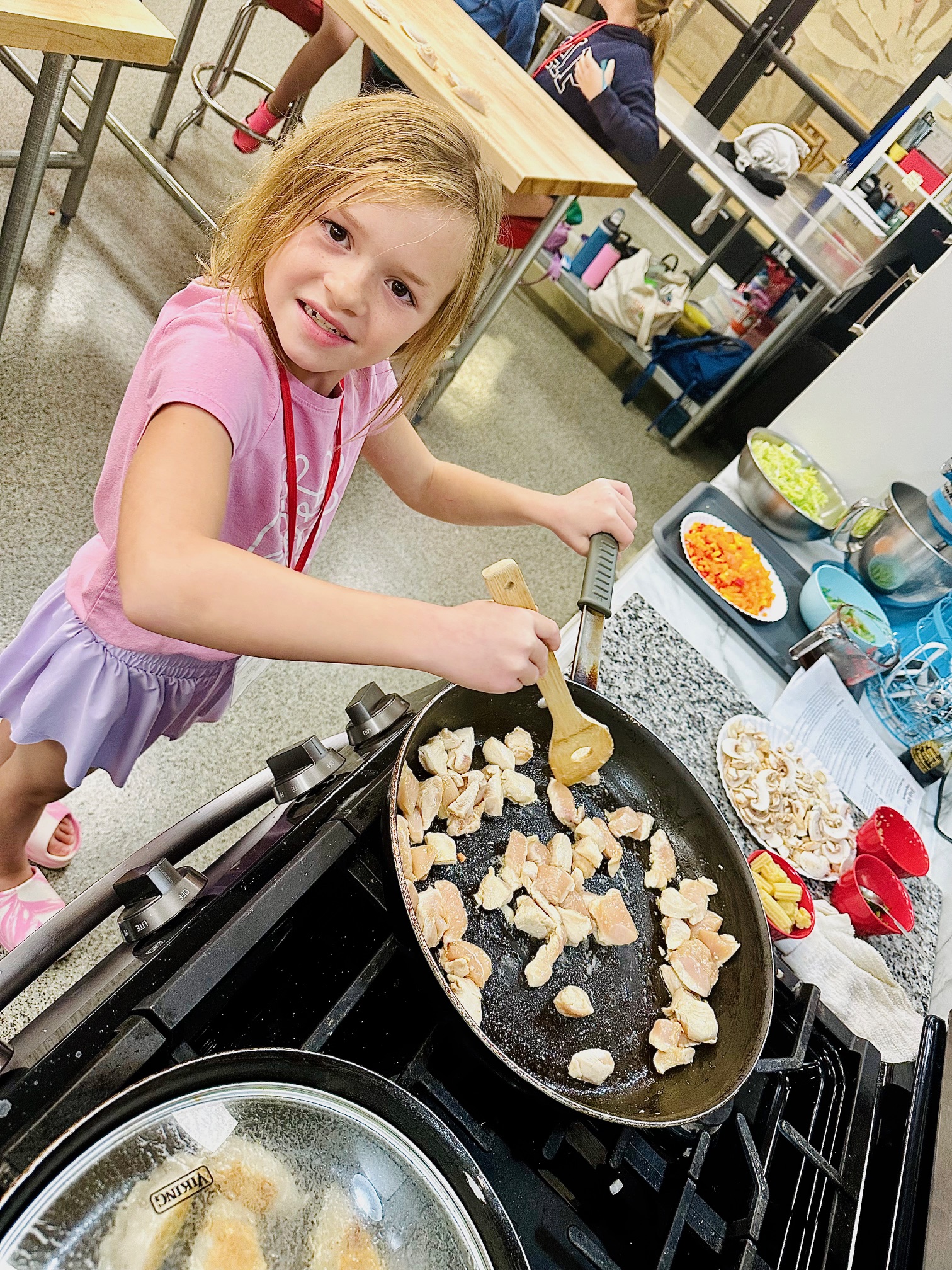 a woman holding a baby in a pan
