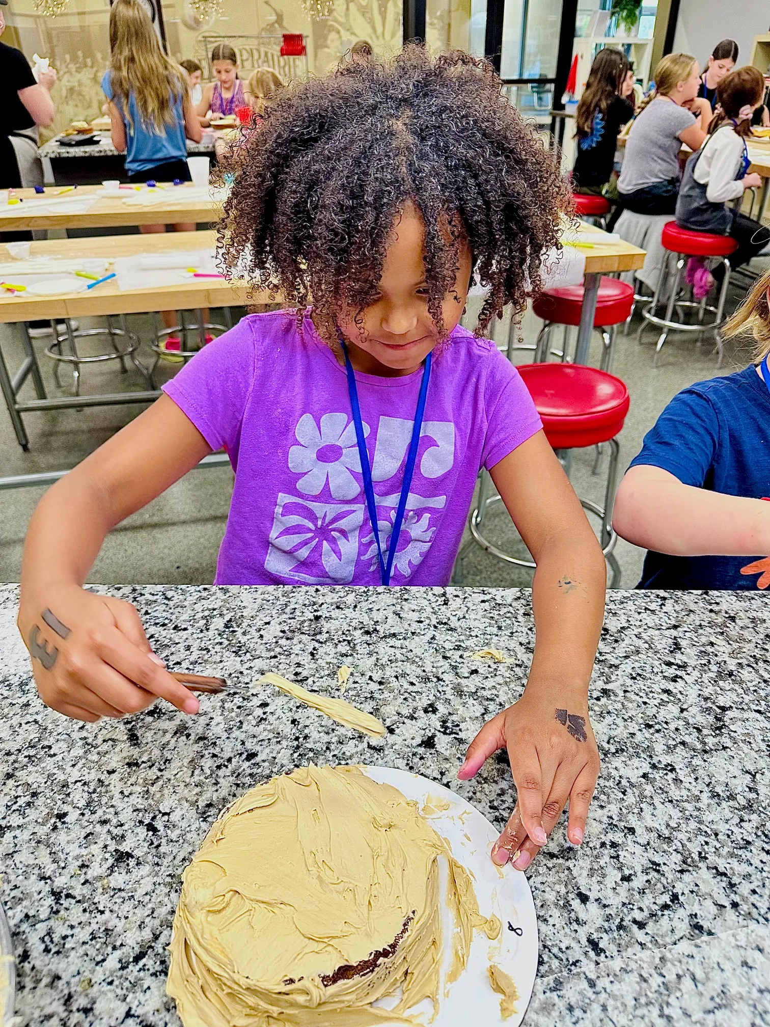 a young boy cutting a cake