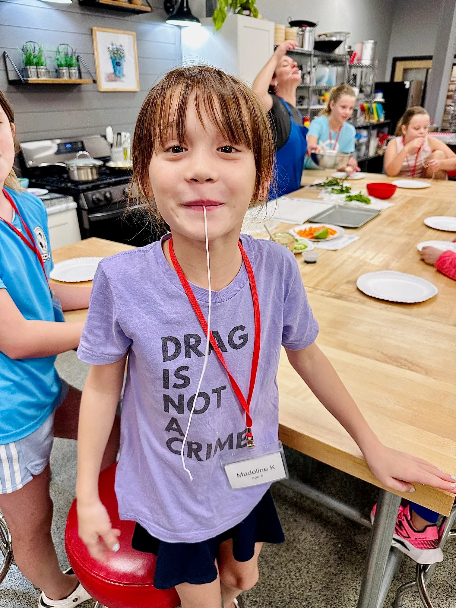a little boy standing on a table