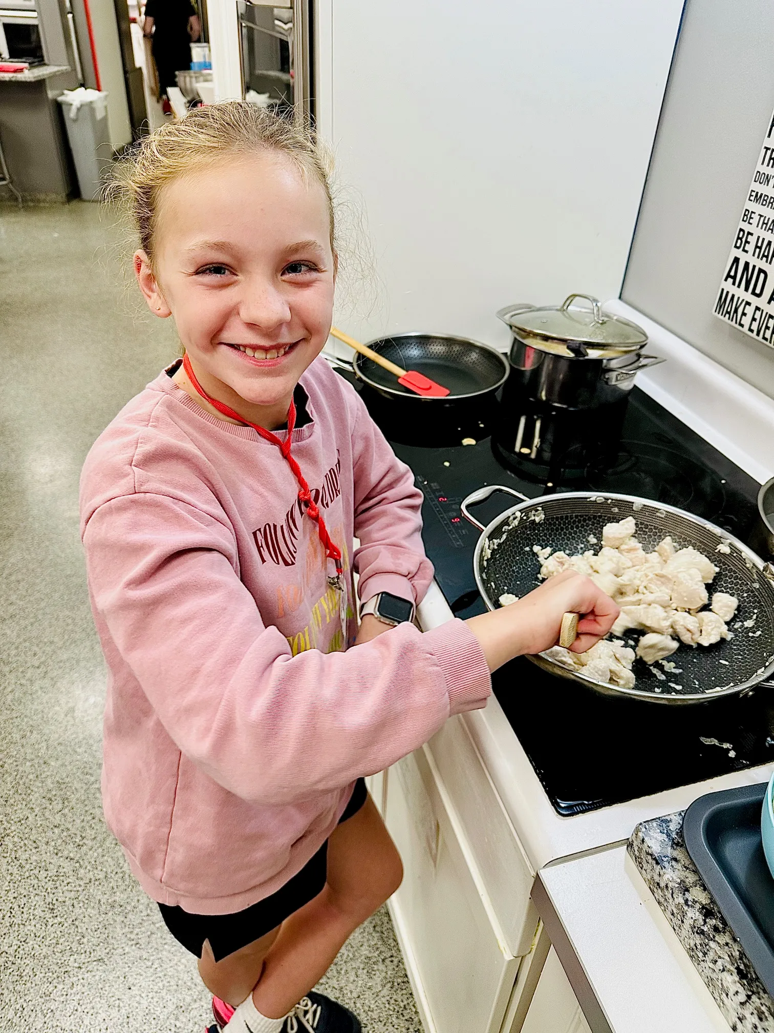 a little boy that is eating some food