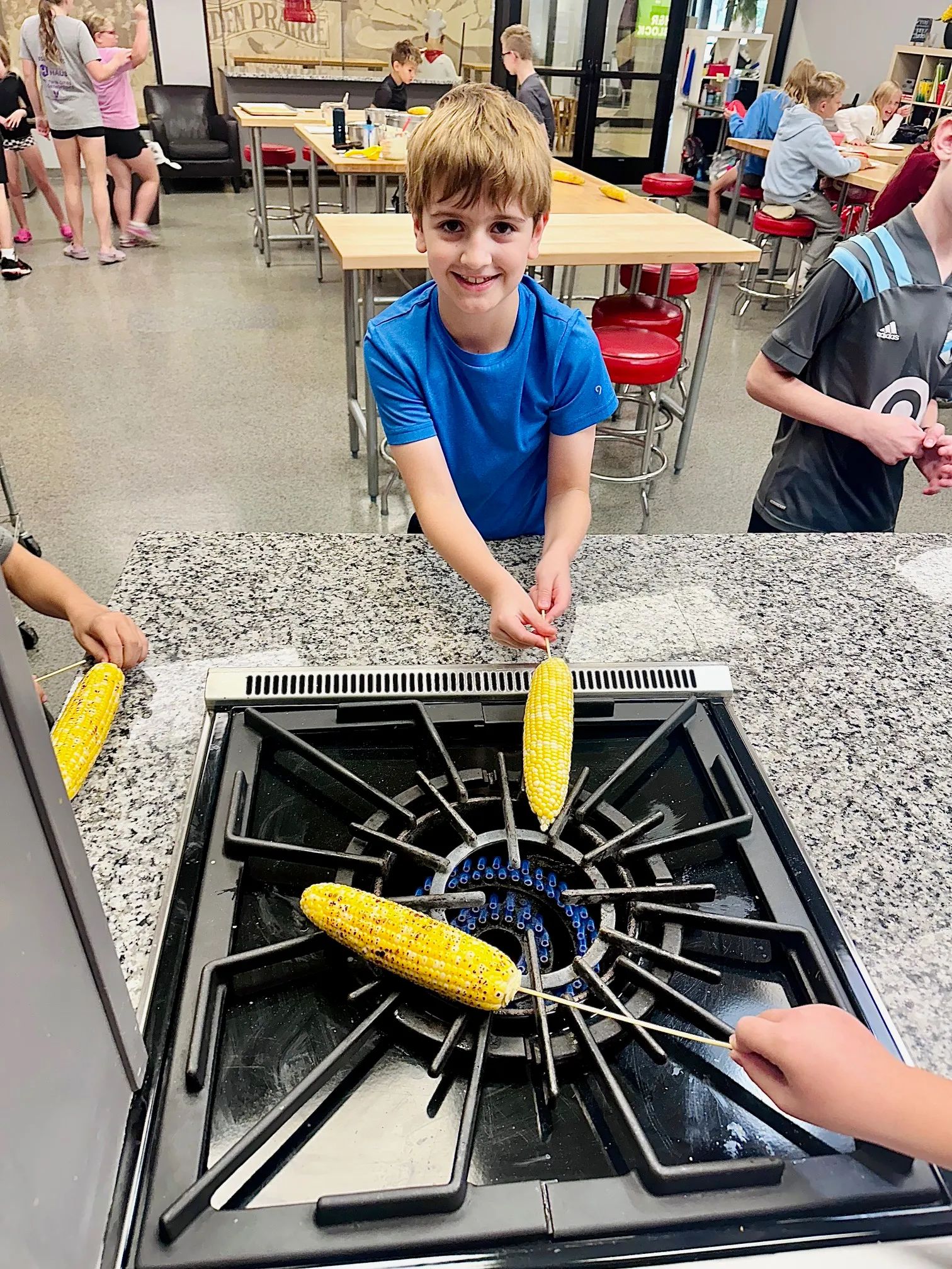 a young boy standing on a cart