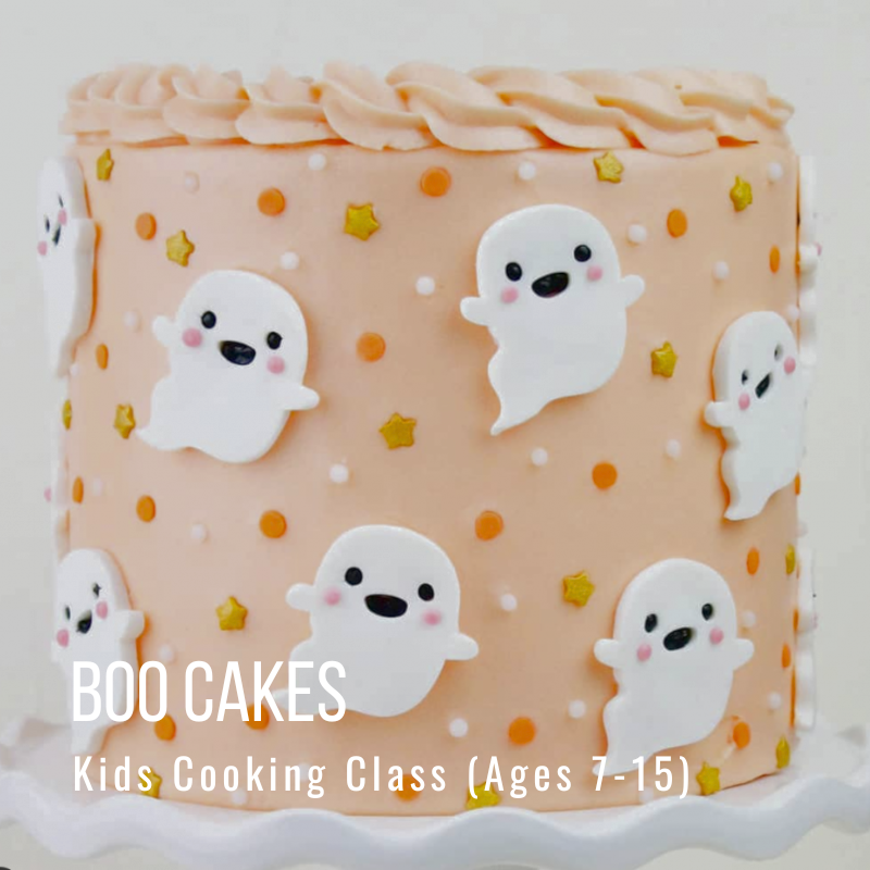 Peach cake with white ghost decorations and small stars.