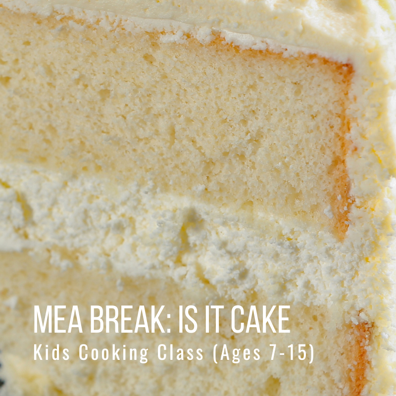 Close-up of a slice of layered yellow cake with frosting.