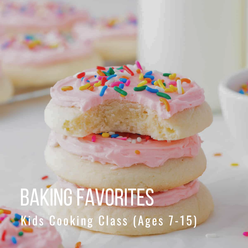 Stack of cookies with pink frosting and sprinkles; one has a bite.