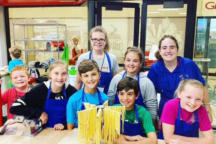 Marlowe Peyton, Valin Shinyei, Ashleigh Aston Moore sitting at a table posing for the camera