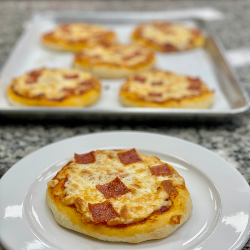 a plate of food with a slice of pizza