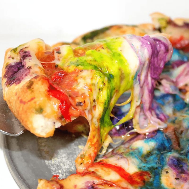 a plate of food with a slice of pizza