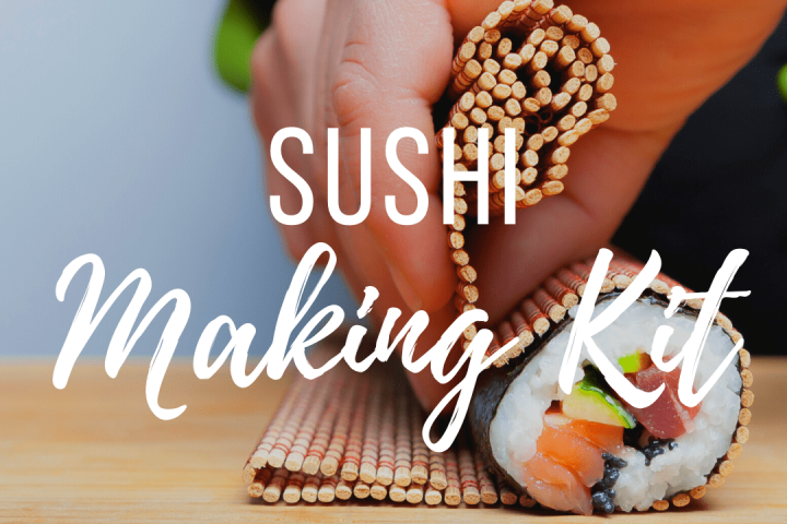 a hand holding a piece of cake