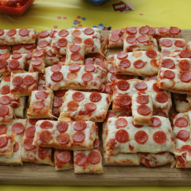 a pizza sitting on top of a cutting board
