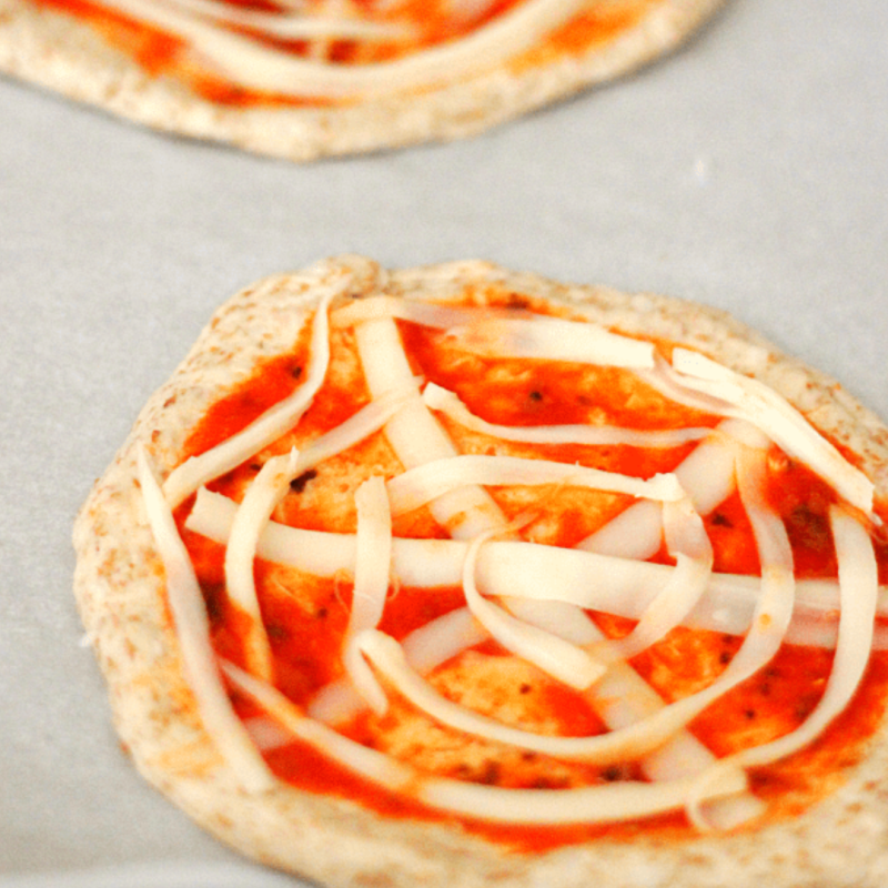 a pizza sitting on top of a pan