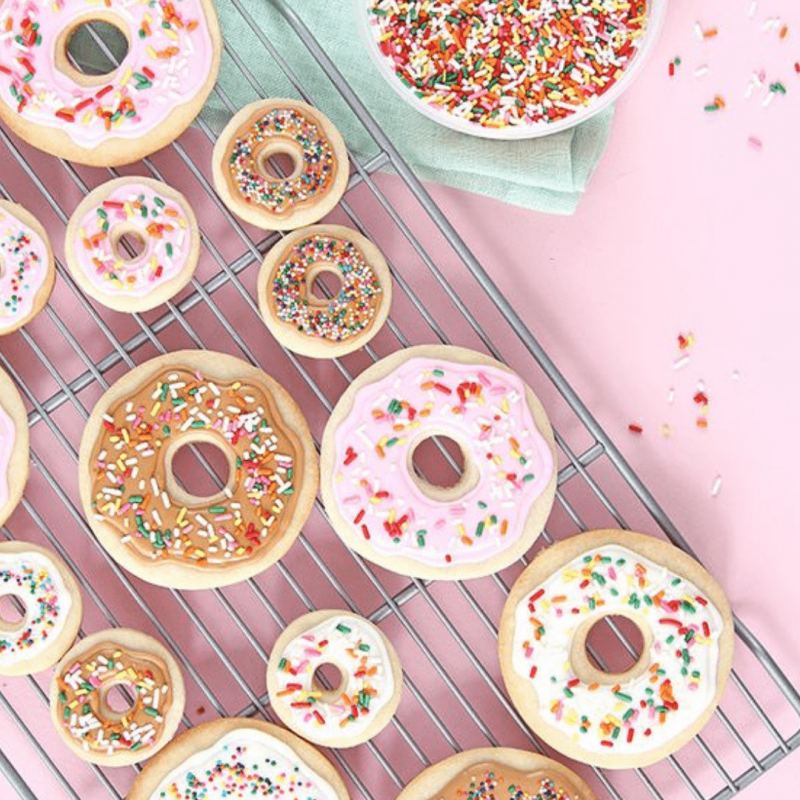 many different types of doughnuts on a table