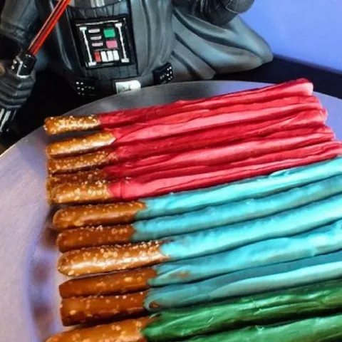 a row of hot dogs on a grill