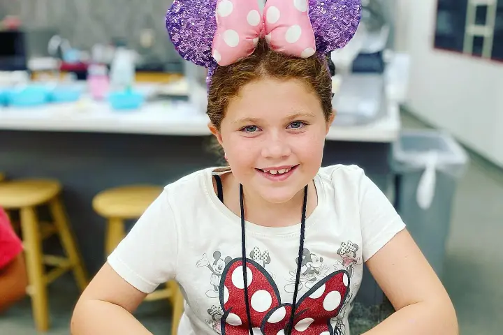 a young boy sitting on a table