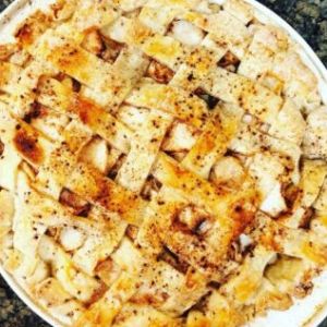 a pizza sitting on top of a plate of food