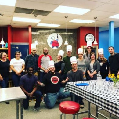 a group of people standing in a room