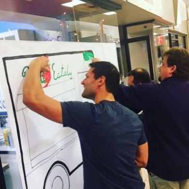 a man standing in front of a machine