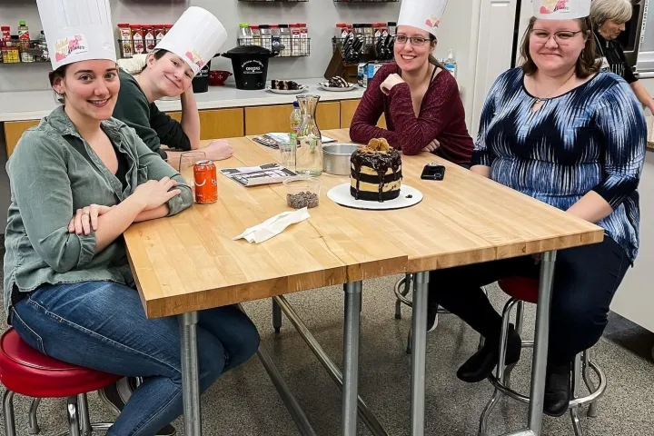 a group of people sitting at a table