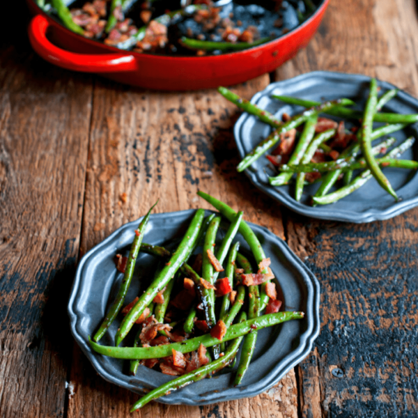 a bowl of salad on a wooden table