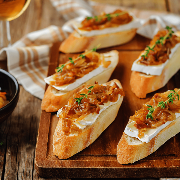 a slice of pizza sitting on top of a wooden table