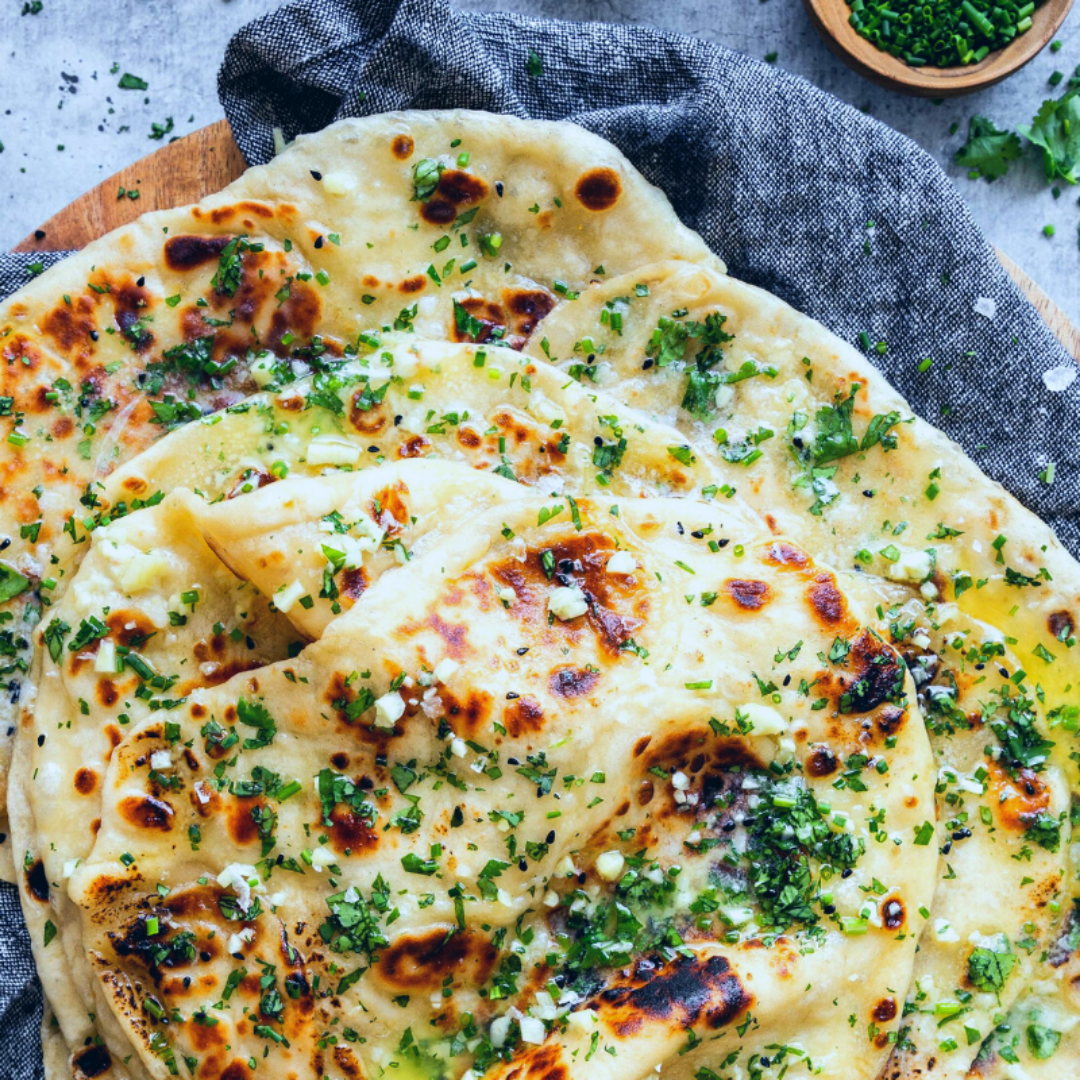 a close up of a pizza with cheese and broccoli