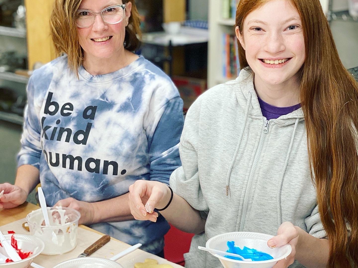 Susan Orlean standing in front of a cake