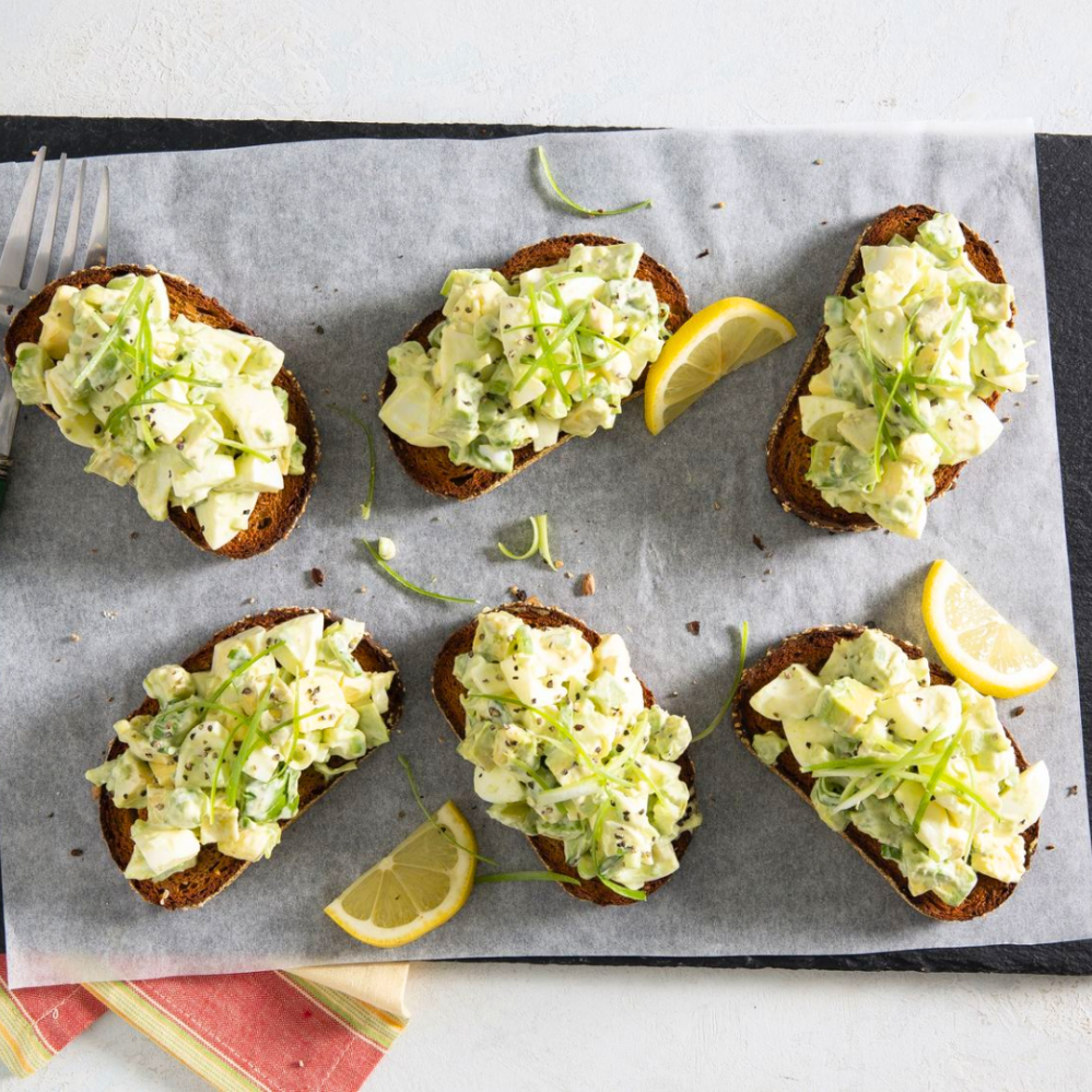 a bunch of different types of food on a table