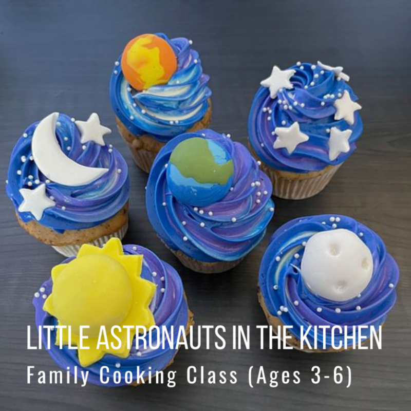 Five cupcakes with space-themed decorations: planets, stars, and moons.