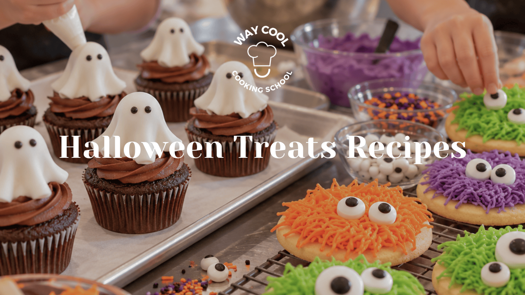 Halloween-themed cupcakes and cookies decorated with ghosts and monster eyes.